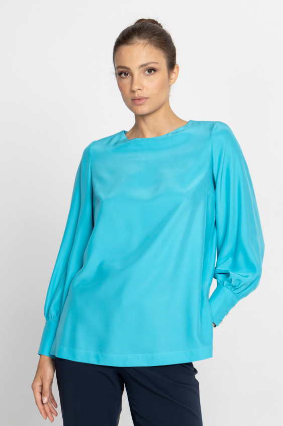 Turquoise silk blouse with striking cuffs 