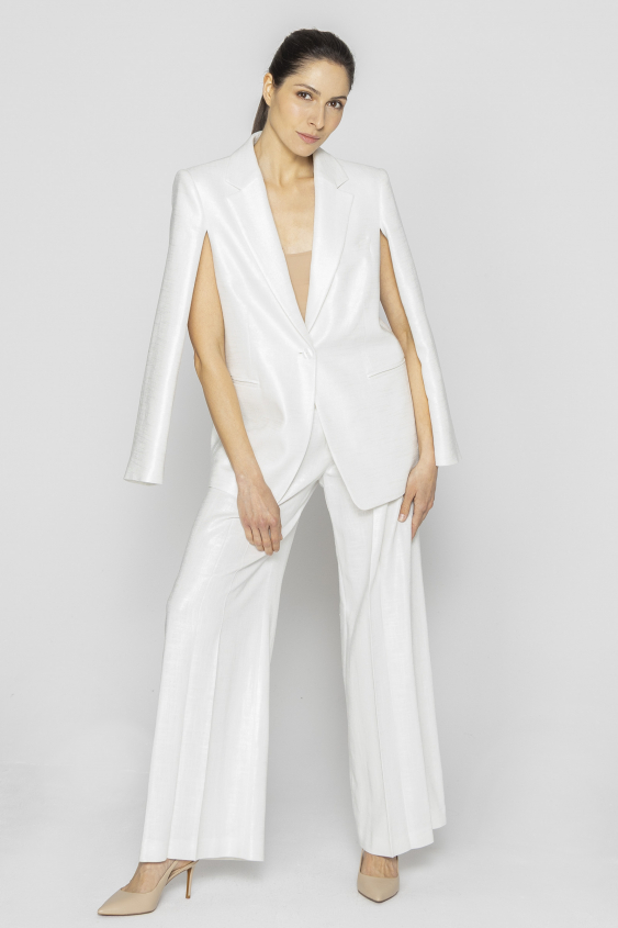 White elegant trousers with loose legs
