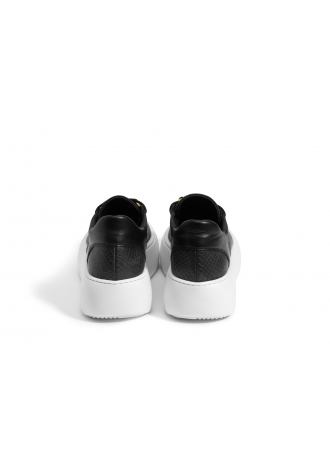 Black sneakers with white soles
