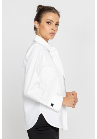 White blouse with a pleat transitioning into a tie 