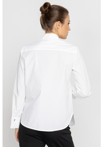 White blouse with a pleat transitioning into a tie 