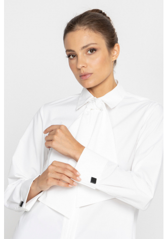 White blouse with a pleat transitioning into a tie 