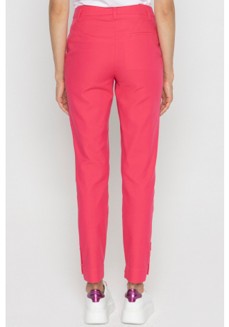 Pink trousers with decorative buttons on the cuffs 