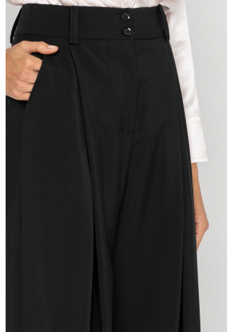 Wide black trousers with a box pleat