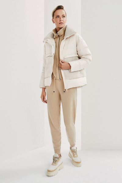 Cream quilted jacket with fur on the front and on the collar 