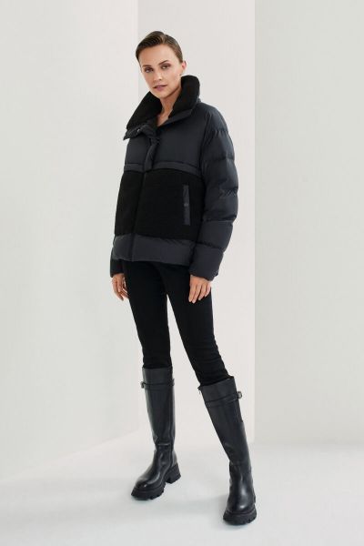 Black quilted jacket with fur on the front and on the collar 