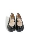  Black moccasins with beige fur 