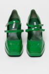 Green painted loafers with a thick sole and square heels