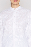 White high-collar shirt with a floral motif 