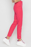 Pink trousers with decorative buttons on the cuffs 