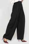 Wide black trousers with a box pleat