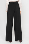 Wide black trousers with a box pleat