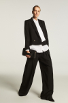 Wide black trousers with a box pleat