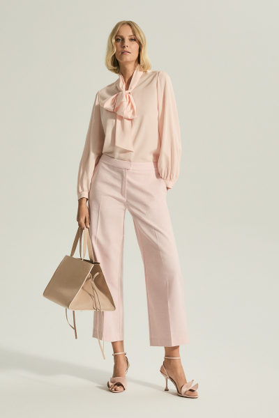 Pink elegant shirt with a tie at the neck